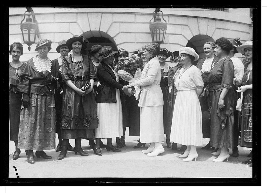 1921 Fashion at the White House:  Bob haircuts, drop waistlines,  fancy trims & collars, strapped shoes with higher & narrower heels. 